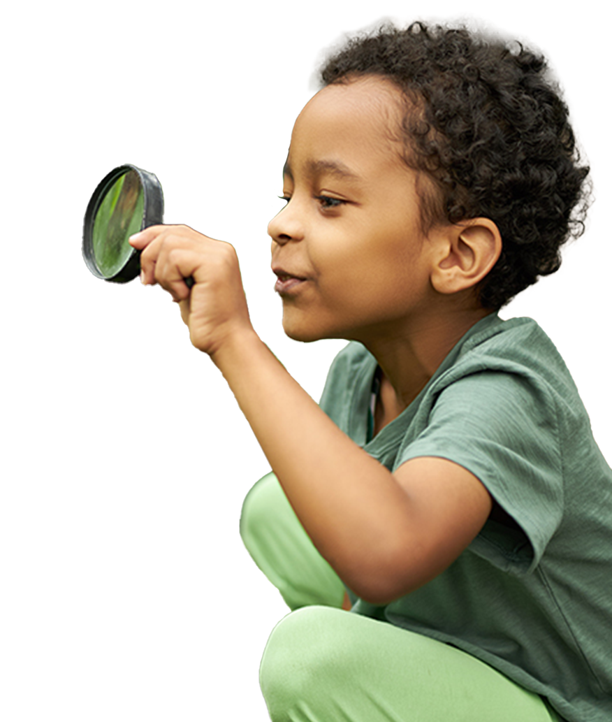 young boy with magnifying glass
